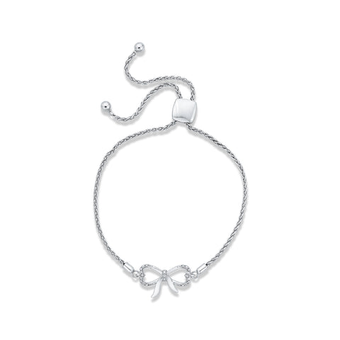 KATARINA Bow and Heart Shaped Infinity Diamond Tennis Bracelet (1/20 cttw)