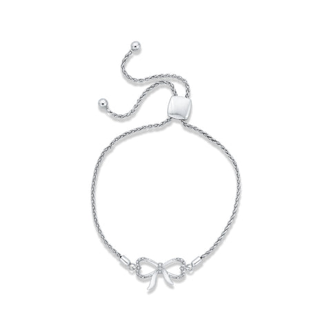 KATARINA Bow and Heart Shaped Infinity Diamond Tennis Bracelet (1/20 cttw)
